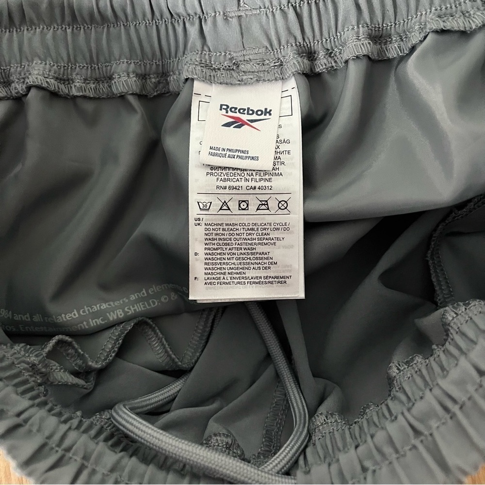 REEBOK sz S Wonder Women Gray Woven Track Pants Sheer Panels Reflective Piping - Picture 8 of 9